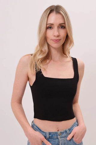 The model is wearing a black Anjelika Square Neck Top by Chloe Colette showing the front side.