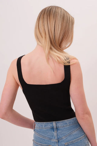 The model is wearing a black Anjelika Square Neck Top by Chloe Colette showing the back side.