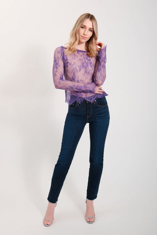 The model is wearing a dark purple Monique Lace Top and Jenny Satin Lavender Mini Skirt by Chloe Colette.