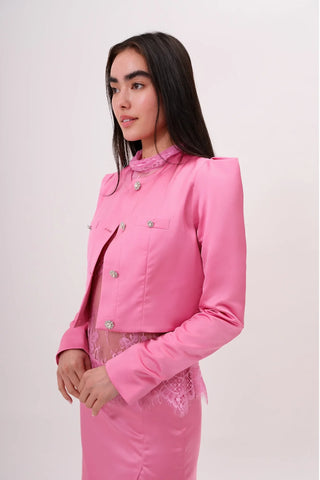 The model is wearing a juliette satin jacket in pink pearl and Jenny Mini Skirt by Chloe Colette