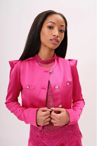 The model is wearing a Juliette Satin Jacket in rosalite Skirt by Chloe Colette.