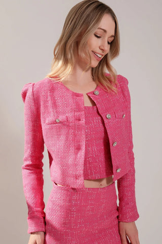 The model is wearing a fuchsia Juliette Tweed Jacket and Jenny Tweed Mini Skirt by Chloe Colette.