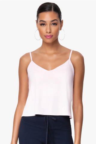 Model is wearing a pink Cassi v neck cami by Chloe Colette.