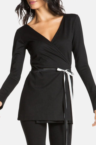 Model is wearing a black Clair Wrap Tunic by Chloe Colette.