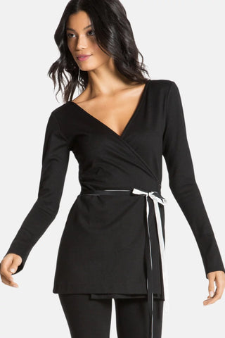 Model is wearing a black Clair Wrap Tunic by Chloe Colette.