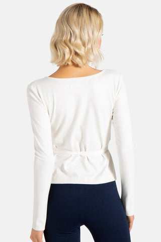 Model is wearing a ivory Clair Wrap Tunic by Chloe Colette.