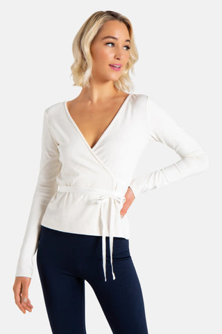 Model is wearing a ivory Clair Wrap Tunic by Chloe Colette.