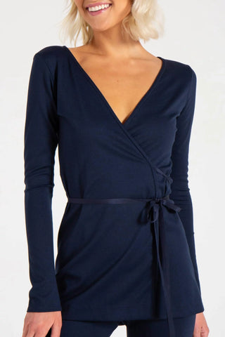 Model is wearing a navy Clair Wrap Tunic by Chloe Colette.