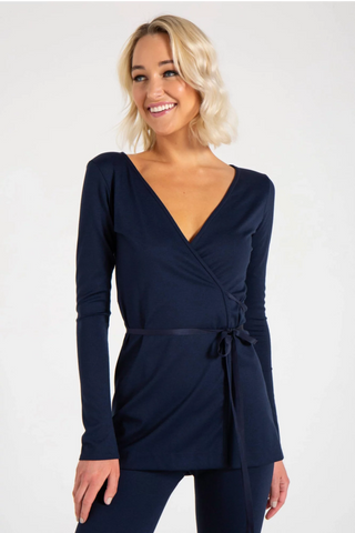 Model is wearing a navy Clair Wrap Tunic by Chloe Colette.