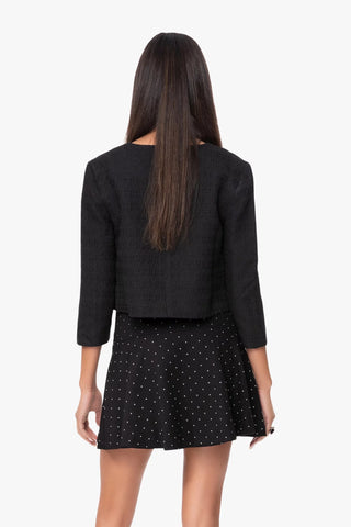 Model is wearing a black coco classic women's jacket by Chloe Colette.