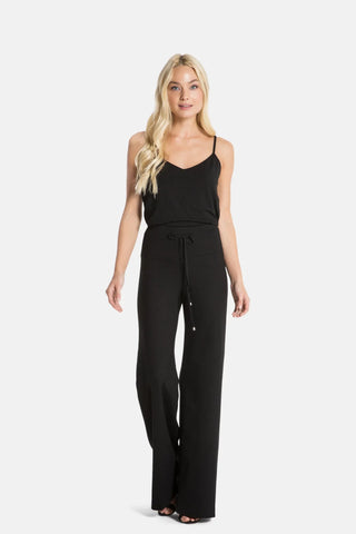 Model is wearing a black wide leg pant Dee Dee by Chloe Colette.
