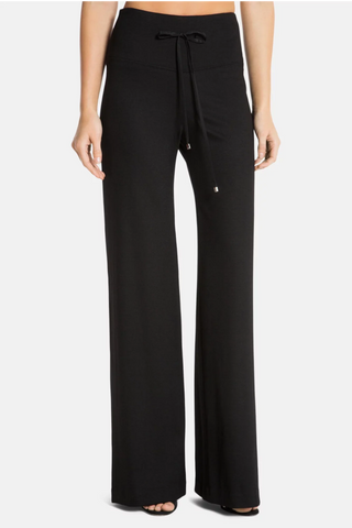 Model is wearing a black wide leg pant Dee Dee by Chloe Colette.