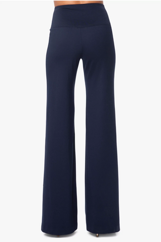 Model wearing a pair of navy Francesca wide leg pants by Chloe Colette.