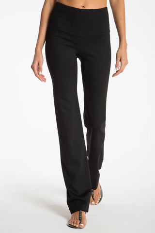 Model wearing a black straight leg pants Jana by Chloe Colette.