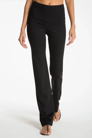 Model wearing a black straight leg pants Jana by Chloe Colette.