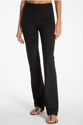 Model wearing a black straight leg pants Jana by Chloe Colette.