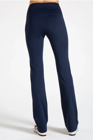 Model wearing a black straight leg pants Jana by Chloe Colette.