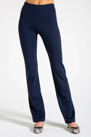 Model wearing a black straight leg pants Jana by Chloe Colette.