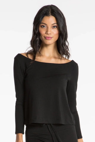 Model is wearing a black Lexi boat neck tee by Chloe Colette.