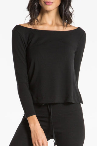 Model is wearing a black Lexi boat neck tee by Chloe Colette.