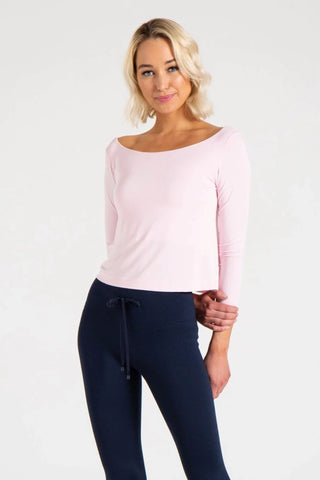 Model is wearing a ballet pink Lexi boat neck tee by Chloe Colette.
