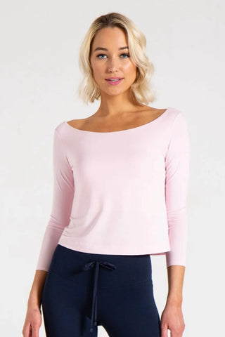 Model is wearing a ballet pink Lexi boat neck tee by Chloe Colette.