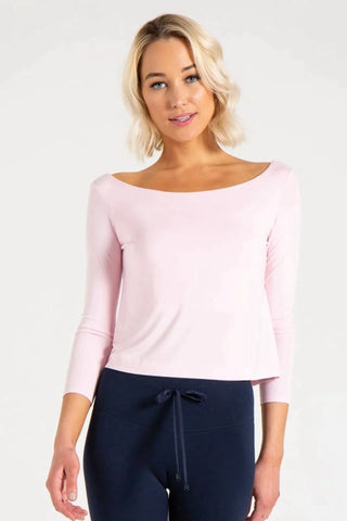 Model is wearing a ballet pink Lexi boat neck tee by Chloe Colette.