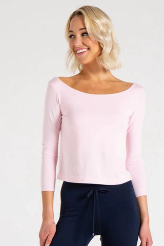 Model is wearing a ballet pink Lexi boat neck tee by Chloe Colette.