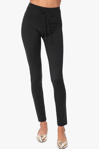 Model is wearing a black London long leggings by Chloe Colette.