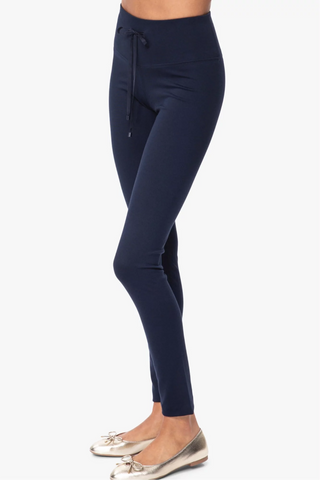Model is wearing a navy London long leggings by Chloe Colette.