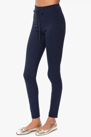 Model is wearing a navy London long leggings by Chloe Colette.