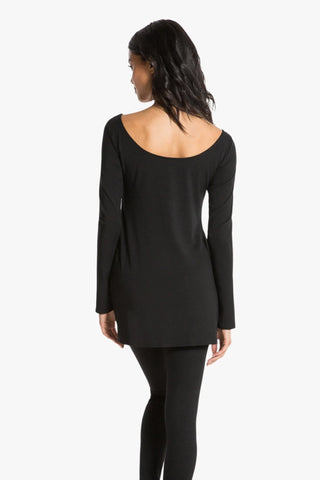 Model is wearing a black Marina boat neck tunic by Chloe Colette.