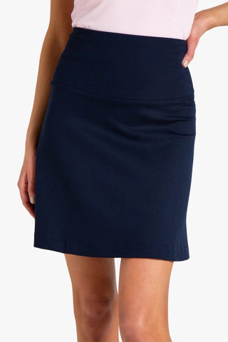 Model is wearing a navy Maxine women's skirt by Chloe Colette.