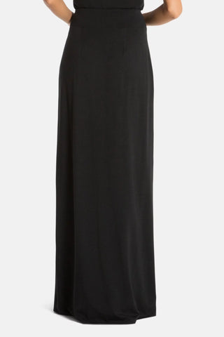 Model is wearing a black Miami maxi skirt by Chloe Colette.