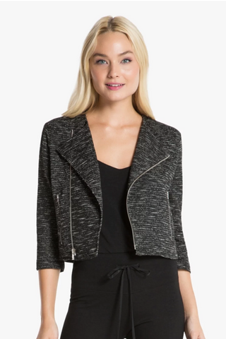 Model is wearing a black and white moto jacket Morgan by Chloe Colette.