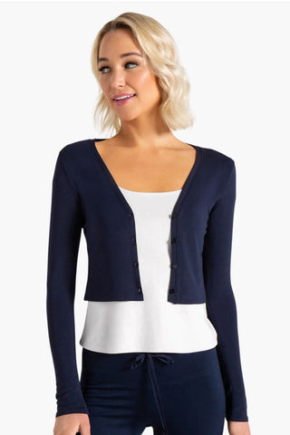 Model is wearing a navy Natasha cardigan by Chloe Colette.