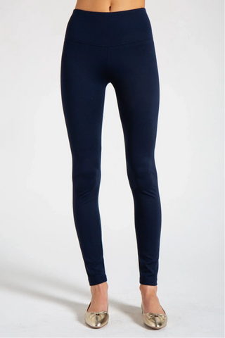 Model is wearing a navy New York long legging by Chloe Colette.