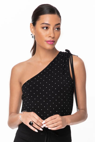 Model is wearing a pindot Julie on shoulder top by Chloe Colette.
