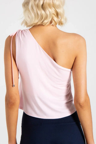 Model is wearing a pindot Julie on shoulder top by Chloe Colette.