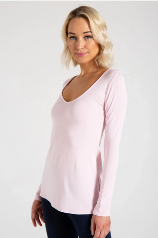 Model is wearing a black Sonja long sleeve tunic tee by Chloe Colette.