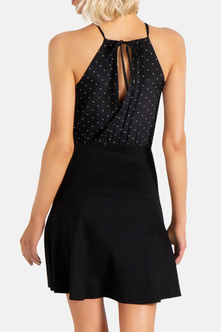 Model is wearing a pindot Stephanie mini dress by Chloe Colette.