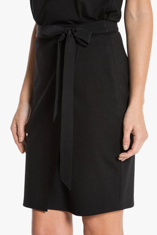 Model is wearing a black Stevie women's skirt by Chloe Colette.