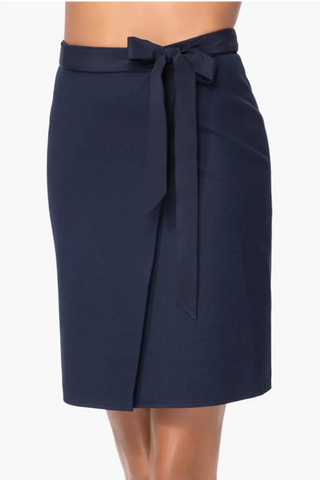 Model is wearing a navy Stevie women skirt by Chloe Colette.
