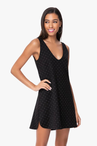 Model is wearing a pindot mini dress Violet by Chloe Colette.