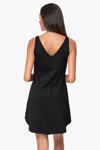 Model is wearing a pindot mini dress Violet by Chloe Colette.