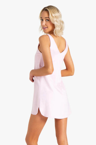 Model is wearing a pink mini dress Violet by Chloe Colette