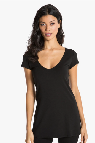 Model is wearing a black short sleeve tunic Virginia by Chloe Colette.