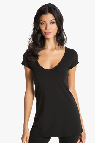 Model is wearing a black short sleeve tunic Virginia by Chloe Colette.
