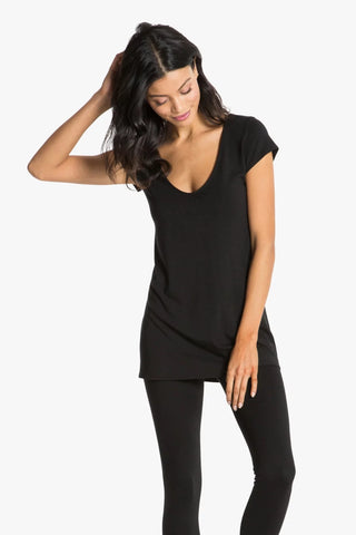 Model is wearing a black short sleeve tunic Virginia by Chloe Colette.