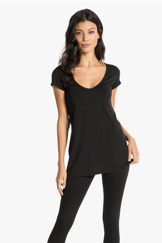 Model is wearing a black short sleeve tunic Virginia by Chloe Colette.
